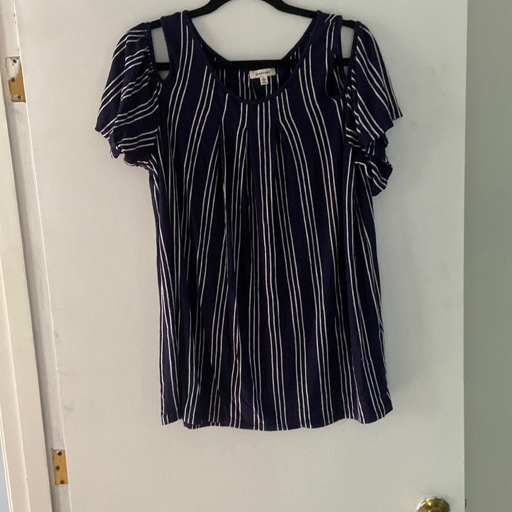 Blue, off the shoulder flowy shirt.